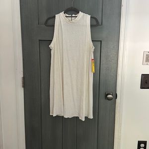 Lightweight, white, mock neck dress with faint geometric designs embossed